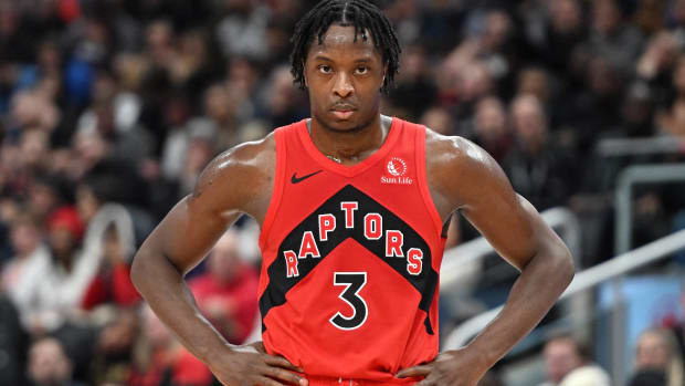 Raptors forward O.G. Anunoby puts his hands on his hips during a game.